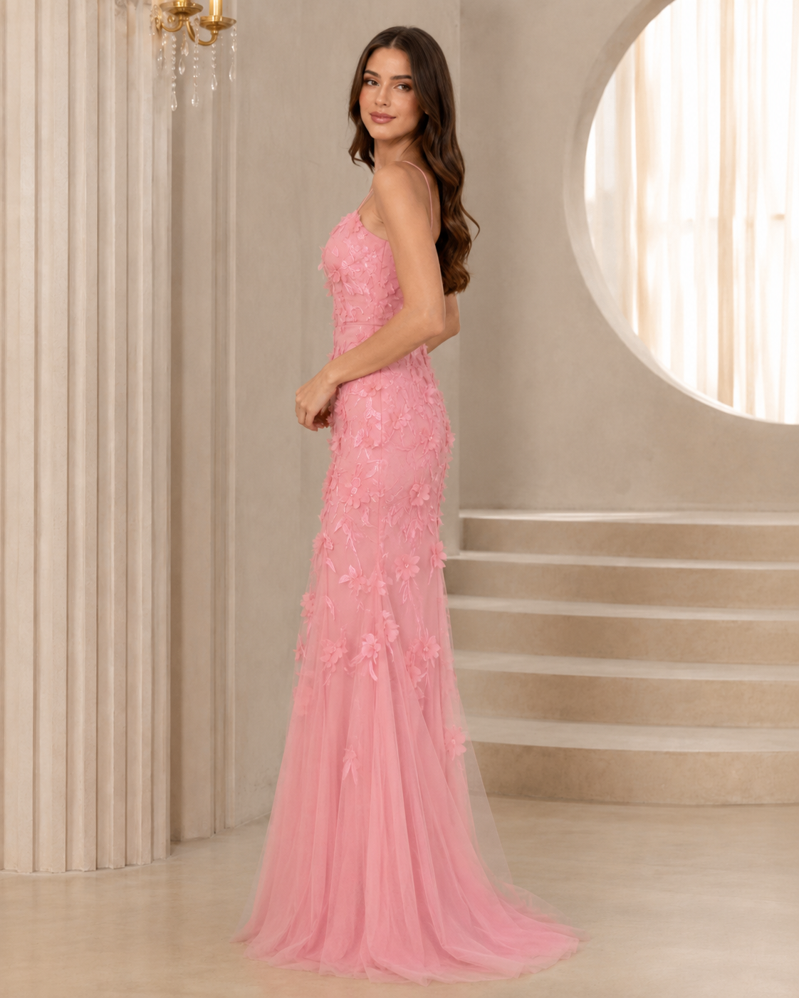 Side view of blush pink fitted mermaid maxi dress with floral appliqué